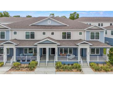 Charming townhomes featuring neutral color schemes and covered front porches for relaxing outdoor living at 452 Diamond Dove Cv, Winter Springs, FL 32708