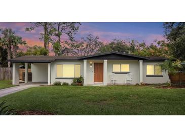 Charming single-story home with a well-maintained lawn, inviting porch, and warm curb appeal at 1945 Bering Ave, Winter Park, FL 32789