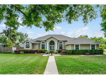 Charming single-story home boasts a well-manicured lawn and inviting curb appeal, perfect for families at 245 Meadow Bay Ct, Lake Mary, FL 32746