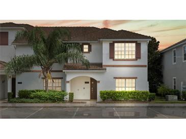 Charming two-story townhome with well-maintained landscaping and a welcoming front entrance at 3193 Pequod Pl, Kissimmee, FL 34746