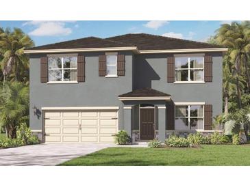 Two-story home featuring a two-car garage, shutters, and a well-manicured lawn at 33604 Seattle Slew Dr, Sorrento, FL 32776