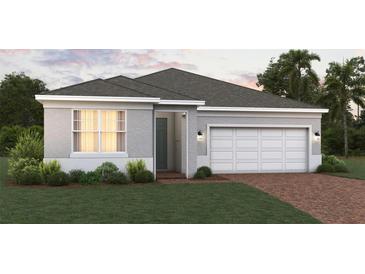 Charming single-story home with a two-car garage and manicured lawn at 2075 Town Pasture Dr, Eustis, FL 32726