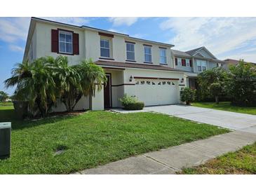 Charming two-story home with a well-manicured lawn and inviting curb appeal at 438 Janice Kay Pl, Kissimmee, FL 34744