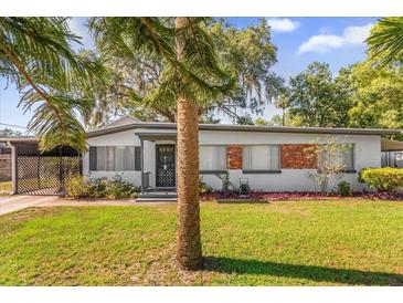 Charming single-story home featuring mature landscaping and a well-maintained front yard at 414 W 19Th St, Sanford, FL 32771