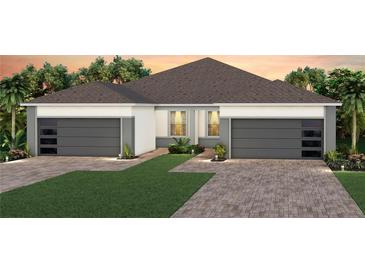 Charming single-story home showcasing a well-manicured lawn and a convenient two-car garage at 13533 Pearl Beach St, Winter Garden, FL 34787