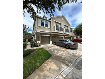 Charming townhouse with a two-car garage and a well-manicured lawn and balcony at 1984 Estancia Circle # 29A, Kissimmee, FL 34741
