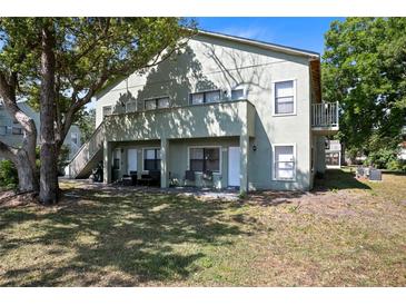 A multi-Gathering home with outdoor seating areas and stairs to the upper units at 5821 La Costa Dr # 108, Orlando, FL 32807