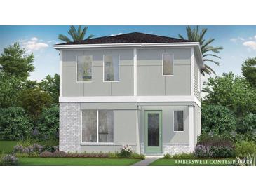 Contemporary two-story home featuring a modern design and a neatly landscaped front yard at 2042 Education St, St Cloud, FL 34771