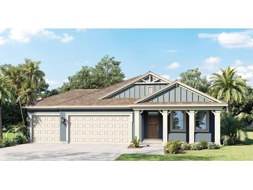Charming one-story home with a three-car garage, covered entry, and well-manicured lawn surrounded by palm trees at 2123 Greenwood Oak Dr, Ocoee, FL 34761