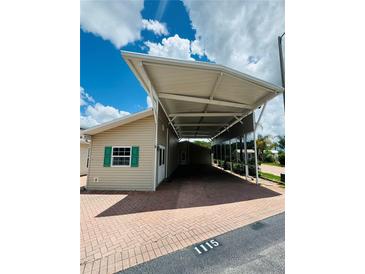 Charming single-story home featuring a convenient covered carport and well maintained exterior at 1115 Deer Creek Blvd, Davenport, FL 33837