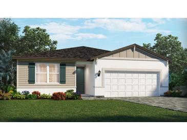Charming one-story home featuring a two-car garage, a well-manicured lawn and colorful landscaping at 1352 Oakhaven Ave, Ormond Beach, FL 32174