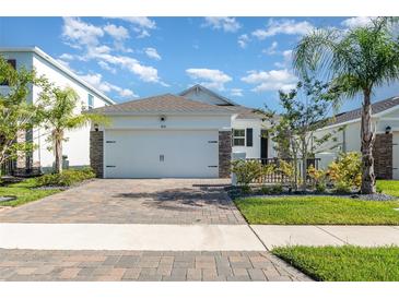 Charming single-Gathering home featuring a two-car garage and well-maintained landscaping at 3110 Areca Ave, New Smyrna Beach, FL 32168