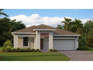 Charming single-story home features a two-car garage, neutral paint, and landscaped front yard with lush green grass at 4674 Coral Harbour Rd, Kissimmee, FL 34758