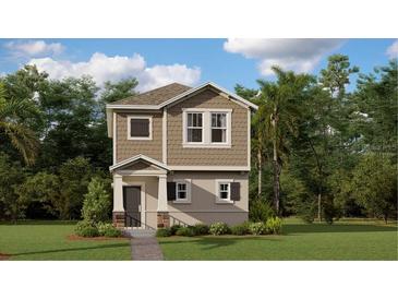 Charming two-story home with neutral color palette, a covered porch and a well maintained lawn at 7227 Sienna Oak Aly, Orlando, FL 32829