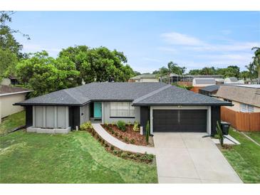 Beautiful single-story home featuring a well-manicured front yard and a spacious two-car garage at 607 Green Briar Blvd, Altamonte Springs, FL 32714