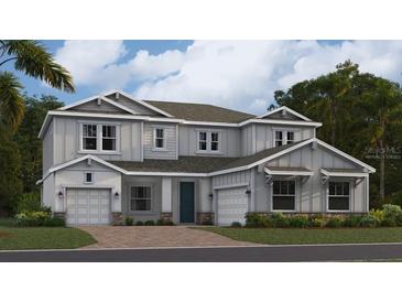 Stunning two-story home featuring a welcoming facade, complemented by a well-manicured lawn and an attached two-car garage at 669 Terrapin Dr, Debary, FL 32713