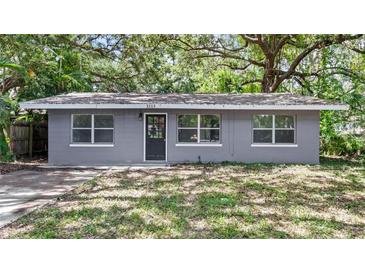 Charming single-story home with a gray exterior and well-maintained front yard at 3115 Avenue U Nw, Winter Haven, FL 33881
