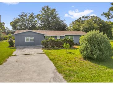 Charming single-story home with well-maintained landscaping and a concrete driveway at 1008 Bay Ave, Lake Wales, FL 33859