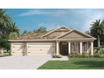 Charming single-story home with a three-car garage and a well-manicured lawn at 7206 Nottingham Reel Ct, St Cloud, FL 34773