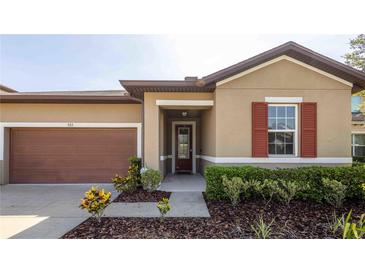 Charming single-Gathering home featuring a well-manicured lawn and inviting front entrance at 922 Suffolk Pl, Davenport, FL 33896