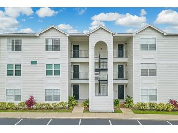 Traditional-style condo featuring three stories and multiple entrances at 2550 Alafaya Trl # 9303, Orlando, FL 32826