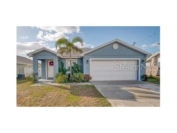 Charming single-story home with a well-maintained lawn and inviting front entrance at 316 Bennett St, Auburndale, FL 33823
