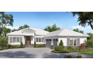 Charming single story home featuring a symmetrical façade, a light colored roof, and lush landscaping at 9517 San Fernando Ct, Howey In The Hills, FL 34737