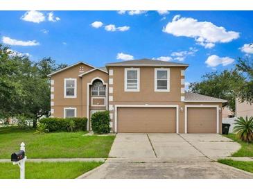 Charming two-story home featuring a three-car garage and well-maintained landscaping at 3322 Park Branch Ave, Clermont, FL 34711