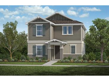 Charming two-story home with craftsman details, gray siding, and well-maintained landscaping at 742 Overpool Ave, Davenport, FL 33896