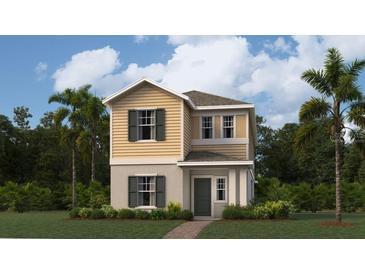 Charming two-story home showcasing classic design elements and a well-manicured lawn with lush landscaping at 7167 Rosy Sky Ave, Orlando, FL 32829