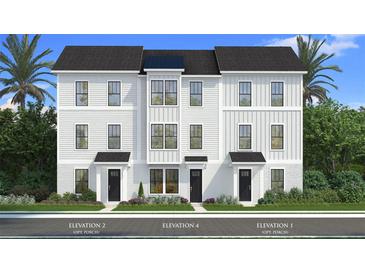 Charming three-story townhome with white siding, black accents, and lush landscaping at 15046 Grove Lake Dr, Winter Garden, FL 34787