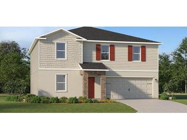 Charming two-story home with gray siding, red shutters, stone accents, and a well-manicured lawn at 3684 Rolling Ridge Bnd, Davenport, FL 33837
