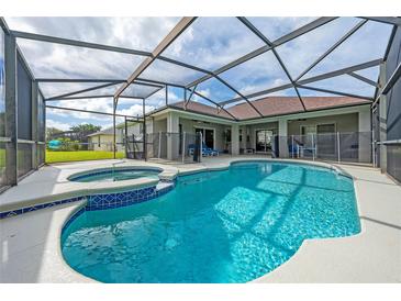 Screened-in pool and hot tub area, perfect for outdoor relaxation and entertaining at 344 Barbera Dr, Davenport, FL 33897
