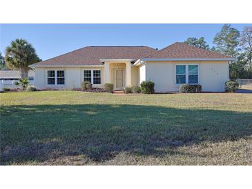 Single-story house with brown roof and a well-maintained lawn at 352 Marion Oaks Ln, Ocala, FL 34473