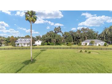 Two homes on a large lot with fenced pastures at 7137 & 7141 S Magnolia Ave, Ocala, FL 34476