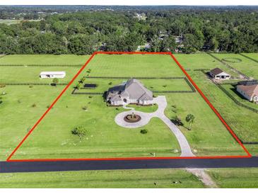 Aerial view of house and expansive lot with pool at 6892 Nw 54Th Loop, Ocala, FL 34482