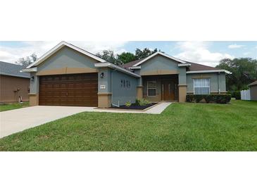 Charming single-story home featuring a well-maintained lawn and attached two car garage at 4085 Sw 49Th Ave, Ocala, FL 34474