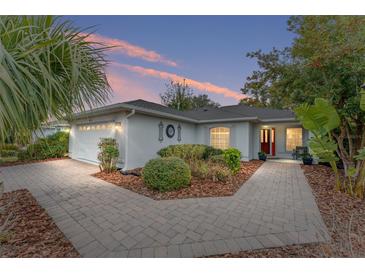 Charming single-story home with landscaped yard and paver driveway at 8718 Sw 83Rd Loop, Ocala, FL 34481