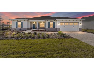 One-story home with a two-car garage and landscaped yard at 10832 Sw 101St Loop, Ocala, FL 34481