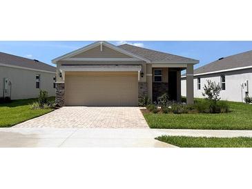 Charming single-story home with a brick-paved driveway and well-maintained landscaping at 4072 Nw 44Th Cir, Ocala, FL 34482