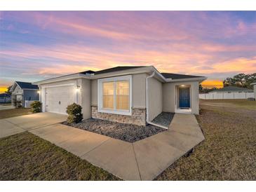 One-story home with attached garage and landscaped yard at 4955 Se 89Th Place Rd, Ocala, FL 34480