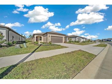 Single-story home with attached garage and well-manicured landscaping at 5624 Sw 88Th Ave, Ocala, FL 34481