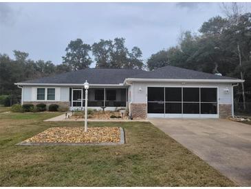 One-story home with screened porch and attached garage at 5555 Sw 107Th St, Ocala, FL 34476