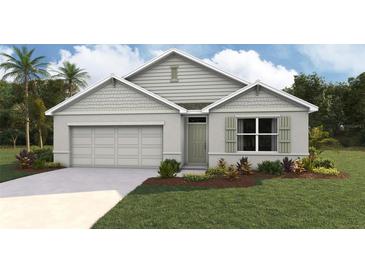 One-story home with gray siding, a two-car garage, and landscaping at 342 Hickory Course Trl, Ocala, FL 34472