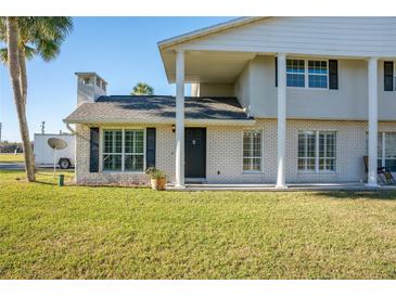 Brick house with a covered entryway, and a manicured lawn at 4343 Nw 80Th Ave # 4, Ocala, FL 34482