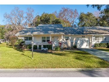 Single-story home with a carport and well-maintained lawn at 8653 Sw 96Th St # A, Ocala, FL 34481