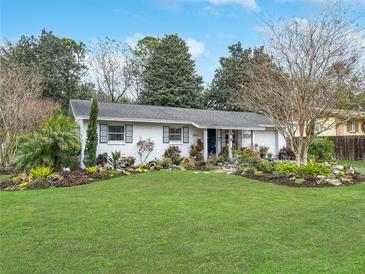 Charming ranch home with beautifully landscaped front yard at 3805 Se 138Th Pl, Summerfield, FL 34491