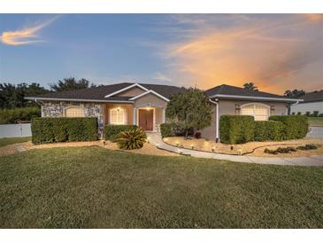 Stunning one-story home with stone accents and landscaped yard at 3819 Se 38Th Loop, Ocala, FL 34480