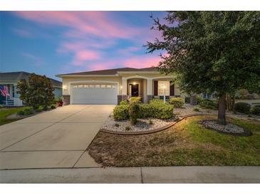 One-story home with landscaped yard and covered porch at 8230 Sw 78Th Cir, Ocala, FL 34476