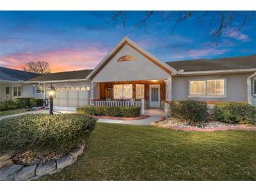 Charming single-story home with a covered porch and well-manicured lawn at 8961 Sw 94Th Ln # C, Ocala, FL 34481